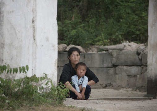 North Korean woman with her child in the street, North Hwanghae Province, Kaesong, North Korea