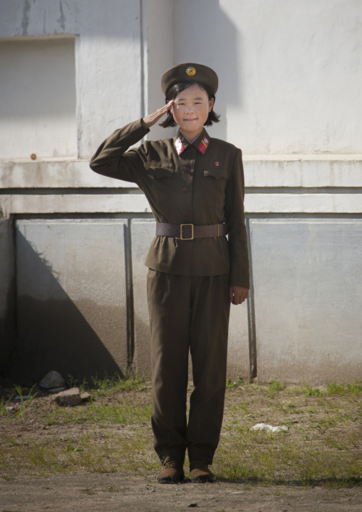 North Korean female soldier saluting, South Pyongan Province, Chonsam Cooperative Farm, North Korea
