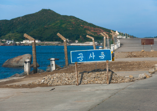 Fences along the east sea with a road sign about construction, North Hamgyong Province, Chilbo Sea, North Korea