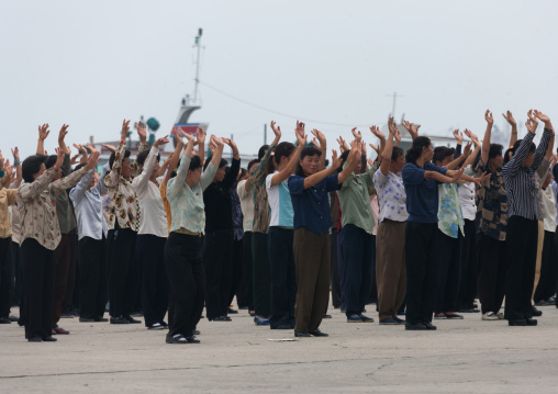 Women raising hands during morning exercise session, Kangwon Province, Wonsan, North Korea