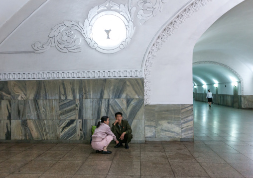 North Korean couple resting in the subway station, Pyongan Province, Pyongyang, North Korea