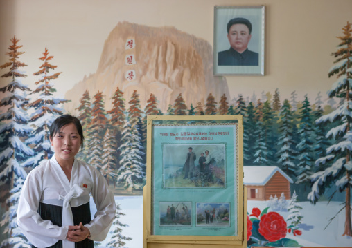 North Korean teacher in a classroom telling the life of Kim Jong il in Samjiyon, South Pyongan Province, Chongsan-ri Cooperative Farm, North Korea