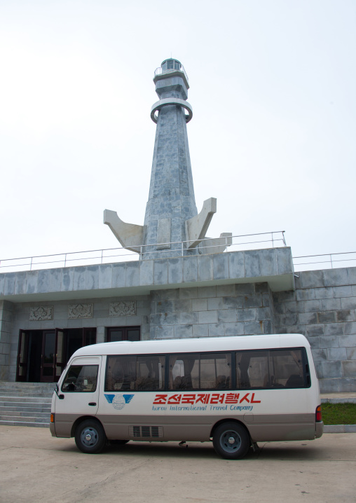 Kitc tourist bus parked in front of the observation platform which is shaped like an anchor on the pi islet on the west sea barrage, South Pyongan Province, Nampo, North Korea