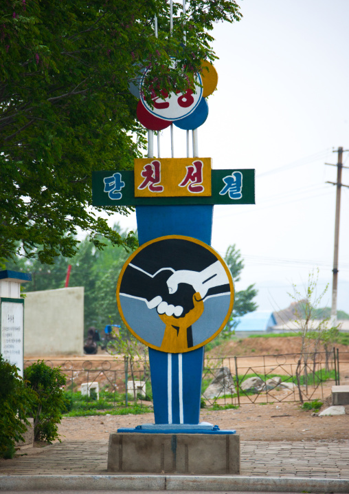 Propaganda billboard saying welcome friendship union in the west sea barrage which separates the Taedong river and the west sea, South Pyongan Province, Nampo, North Korea