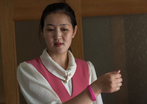 North Korean waitress with a mc donald's bracelet, Pyongan Province, Pyongyang, North Korea