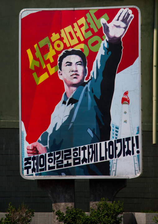 North Korean propaganda poster with a worker rasing his hand, Pyongan Province, Pyongyang, North Korea