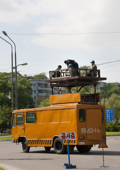 North Korean workers repairing the electric lines for the tramway, Pyongan Province, Pyongyang, North Korea