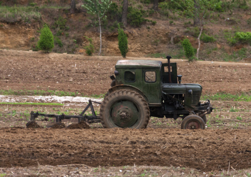 Old North Korean tractor in a field in the countryside, Pyongan Province, Myohyang-san, North Korea