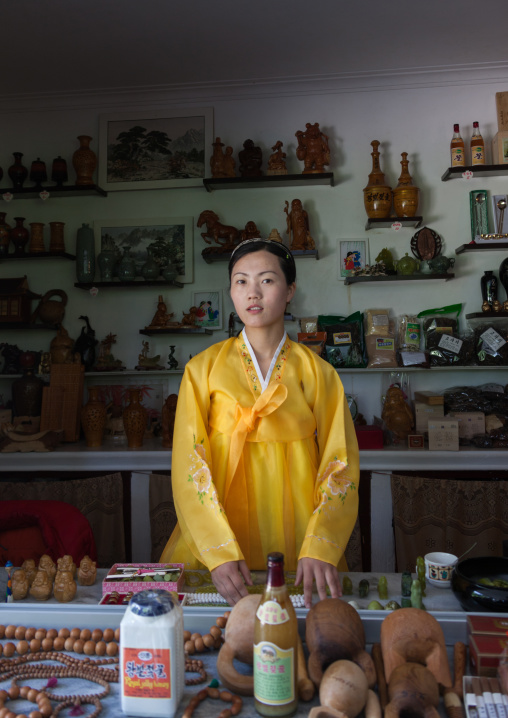 North Korea woman selling souvenirs in Pohyon-sa Korean buddhist temple, North Pyongan Province, Myohyang-san, North Korea