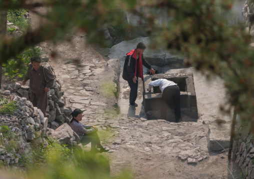 North Korean people taking water from a well, North Hwanghae Province, Kaesong, North Korea