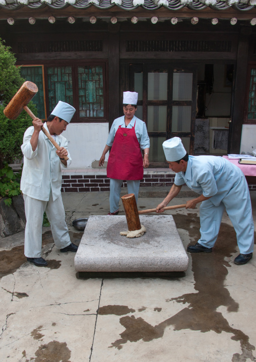 Cooks prepairing rice wafers, North Hwanghae Province, Kaesong, North Korea