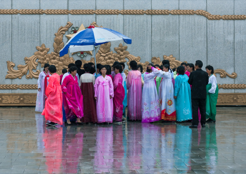 North Korean people under the rain in Kumsusan memorial palace, Pyongan Province, Pyongyang, North Korea