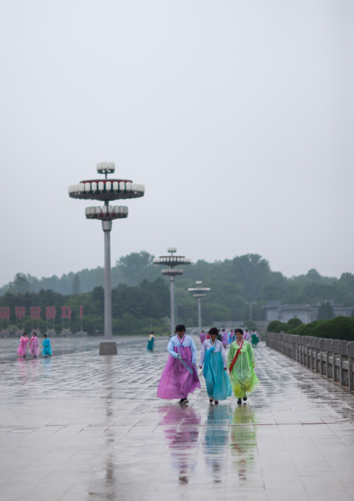 North Korean women under the rain in Kumsusan memorial palace, Pyongan Province, Pyongyang, North Korea