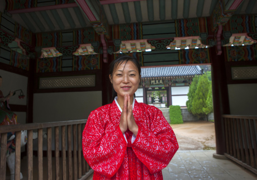North Korean woman with hands joined in Kwangbok temple, Pyongan Province, Pyongyang, North Korea