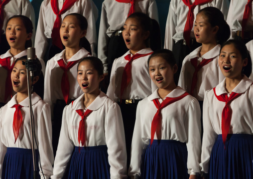 North horean pioneers singing during a show at Mangyongdae children's palace, Pyongan Province, Pyongyang, North Korea