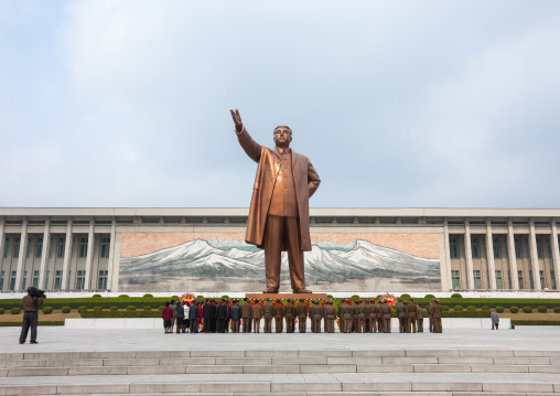 North Korean people bowing in front of Kim il Sung statue in Mansudae Grand monument, Pyongan Province, Pyongyang, North Korea