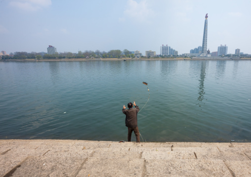 North Korean man fishing in Taedong river, Pyongan Province, Pyongyang, North Korea