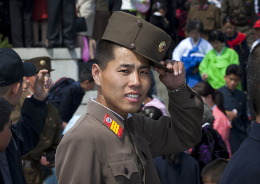 North Korean soldier with a relaxed attitude in the street, Pyongan Province, Pyongyang, North Korea