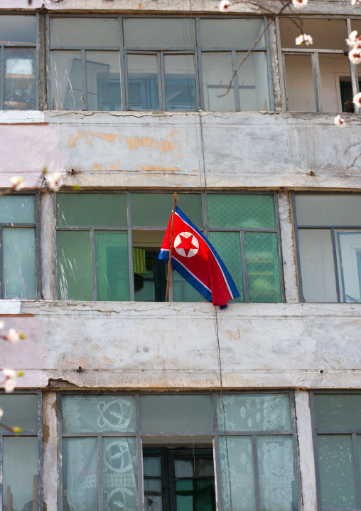 North Korean flag at a decrepit apartment balcony, Pyongan Province, Pyongyang, North Korea