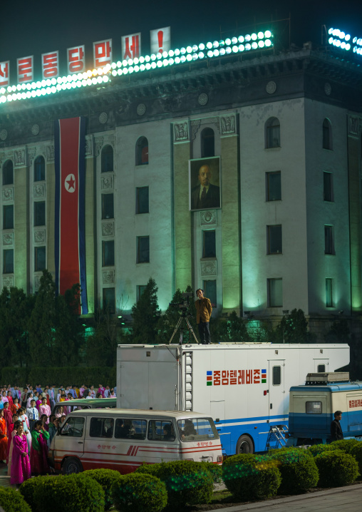 News broadcast bus during a mass dance performance on Kim il Sung square, Pyongan Province, Pyongyang, North Korea