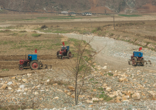 Old North Korean tractors in a field in the countryside, Kangwon Province, Wonsan, North Korea