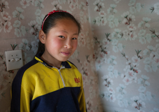 Portrait of a North Korean girl in her house, Kangwon Province, Chonsam Cooperative Farm, North Korea