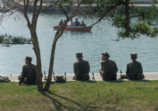 North Korean soldiers resting in front of a lake in Songdowon international children's camp, Kangwon Province, Wonsan, North Korea