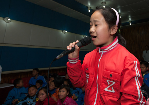 North Korean children singing during a karaoke Songdowon international children's camp, Kangwon Province, Wonsan, North Korea