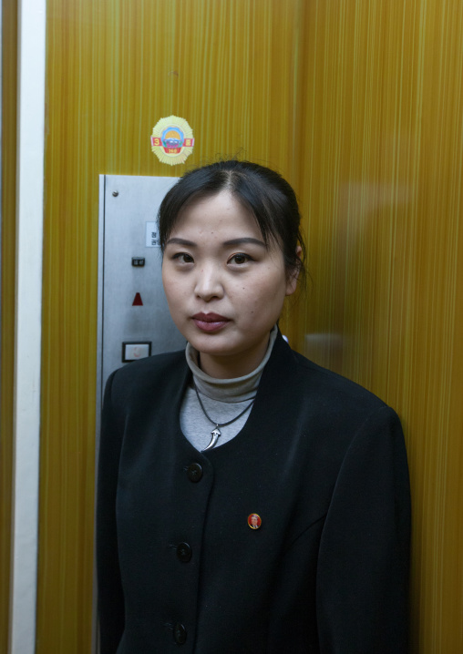 North Korean woman inside an elevator in the Grand people's study house, Pyongan Province, Pyongyang, North Korea