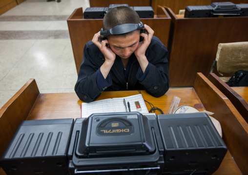 North Korean man listening to music in the multimedia room of the Grand people's study house, Pyongan Province, Pyongyang, North Korea