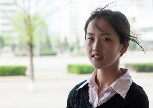 Portrait of a North Korean young woman in the street, Pyongan Province, Pyongyang, North Korea