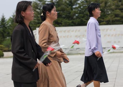 North Korean women bringing flowers to Taesongsan revolutionary martyr's cemetery, Pyongan Province, Pyongyang, North Korea