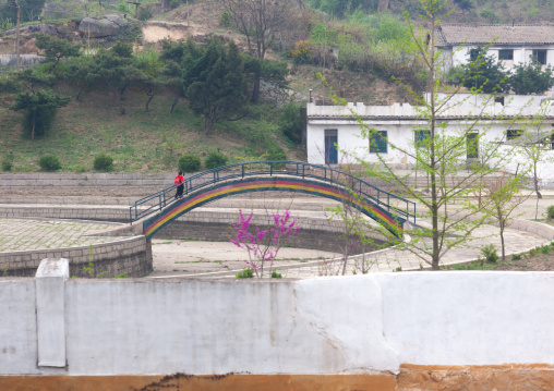 North Korean girl in an abandonned playground, North Hwanghae Province, Kaesong, North Korea