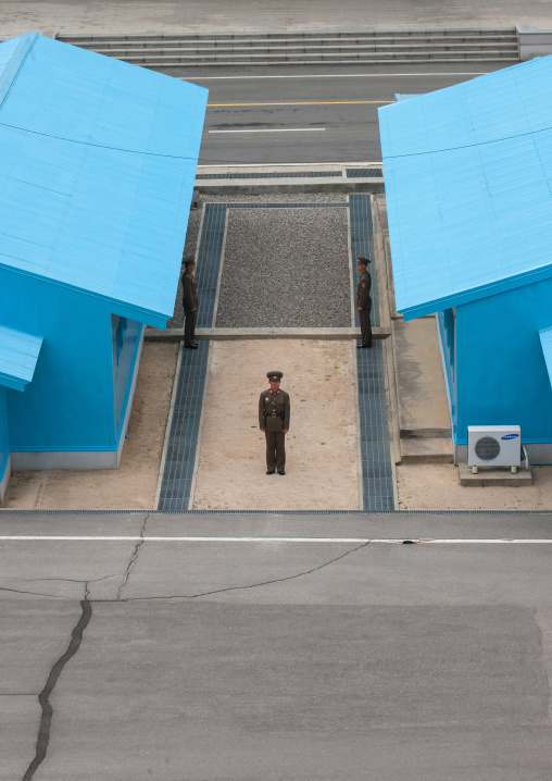 North Korean soldier standing in front of the United Nations conference rooms on the demarcation line in the Demilitarized Zone, North Hwanghae Province, Panmunjom, North Korea
