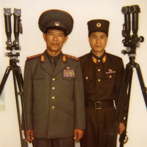 North Korean soldiers standing near binoculars on the Demilitarized Zone, North Hwanghae Province, Panmunjom, North Korea
