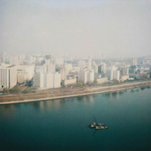 Polaroid of buildings in front of Taedong river, Pyongan Province, Pyongyang, North Korea