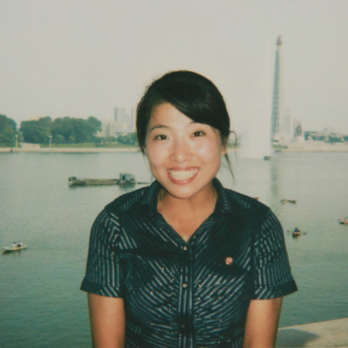Polaroid of a smiling North Korean woman in front of Taedong river, Pyongan Province, Pyongyang, North Korea