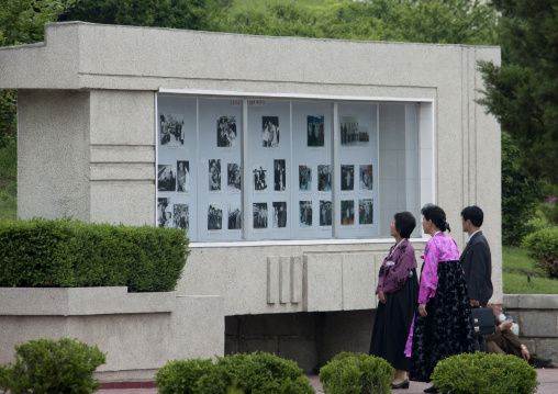 North Korean people in front of a monument depicting the life of the Dear Leaders, Pyongan Province, Pyongyang, North Korea