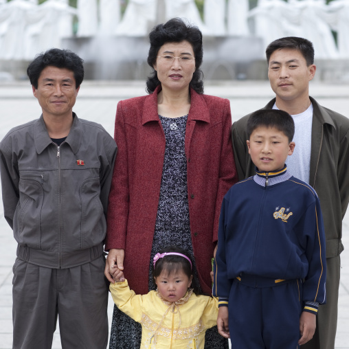North Korean family posing in the street, Pyongan Province, Pyongyang, North Korea