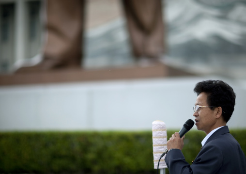North Korean speaker with a microphone in Mansudae Grand monument, Pyongan Province, Pyongyang, North Korea