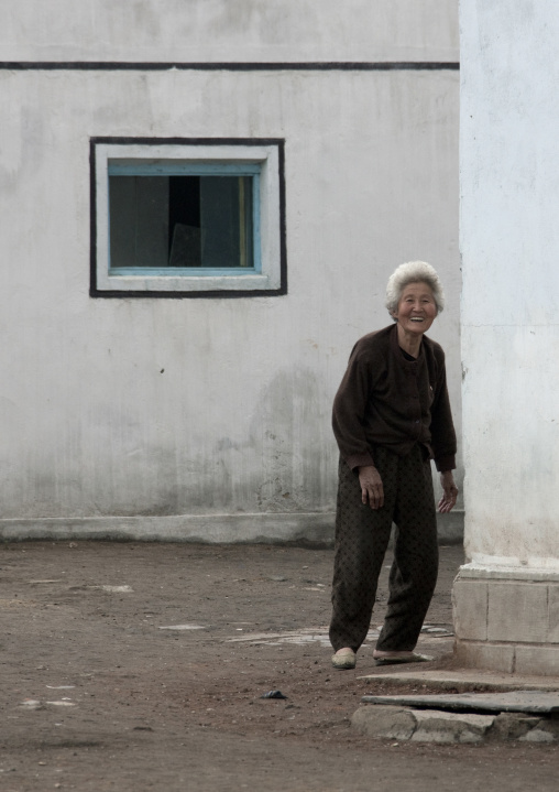 North Korean old woman smiling in the street, South Pyongan Province, Chongsan-ri Cooperative Farm, North Korea