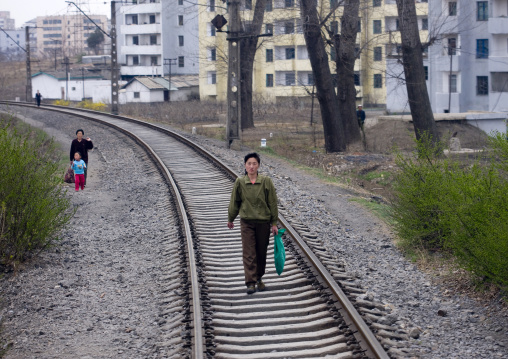 North Korean woman walking on empty railways, Pyongan Province, Pyongyang, North Korea