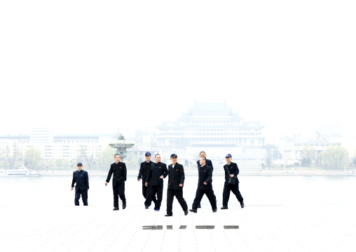North Korean young men in black suits in Kim il Sung square, Pyongan Province, Pyongyang, North Korea