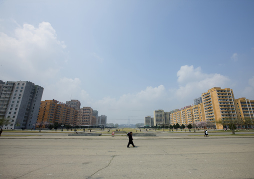 North Korean man walking in the empty town on a sunday afternoon, Pyongan Province, Pyongyang, North Korea