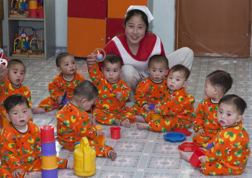 North Korean children in an orphanage with a nurse, South Pyongan Province, Nampo, North Korea