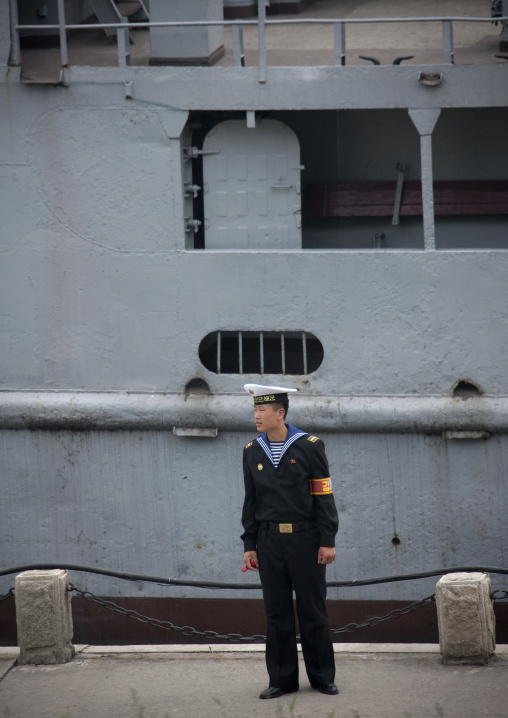 North Korean navy sailor in front of the us spy boat Uss Pueblo, Pyongan Province, Pyongyang, North Korea