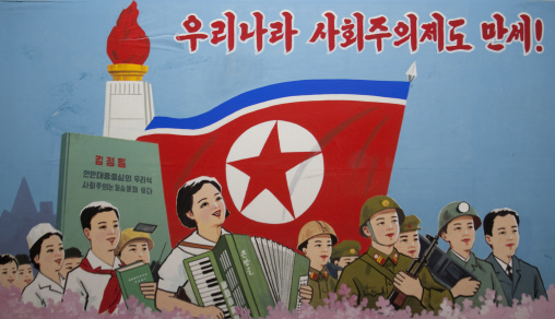 Propaganda poster depicting North Korean citizens iun front of the Juche tower, Pyongan Province, Pyongyang, North Korea