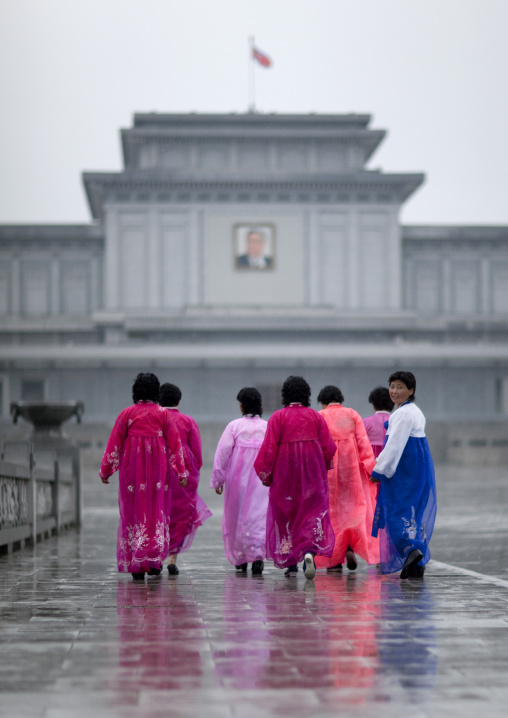 North Korean women under the rain in Kumsusan palace of the sun that serves as the mausoleum for Kim Il-sung and Kim Jong-il, Pyongan Province, Pyongyang, North Korea
