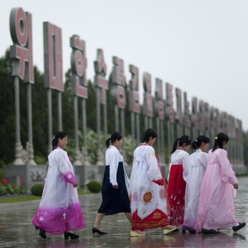 North Korean women under the rain in Kumsusan memorial palace, Pyongan Province, Pyongyang, North Korea