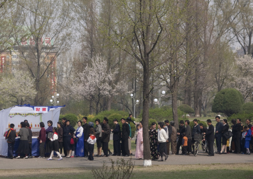 North Korean people queuing to buy some food in a small shop, Pyongan Province, Pyongyang, North Korea